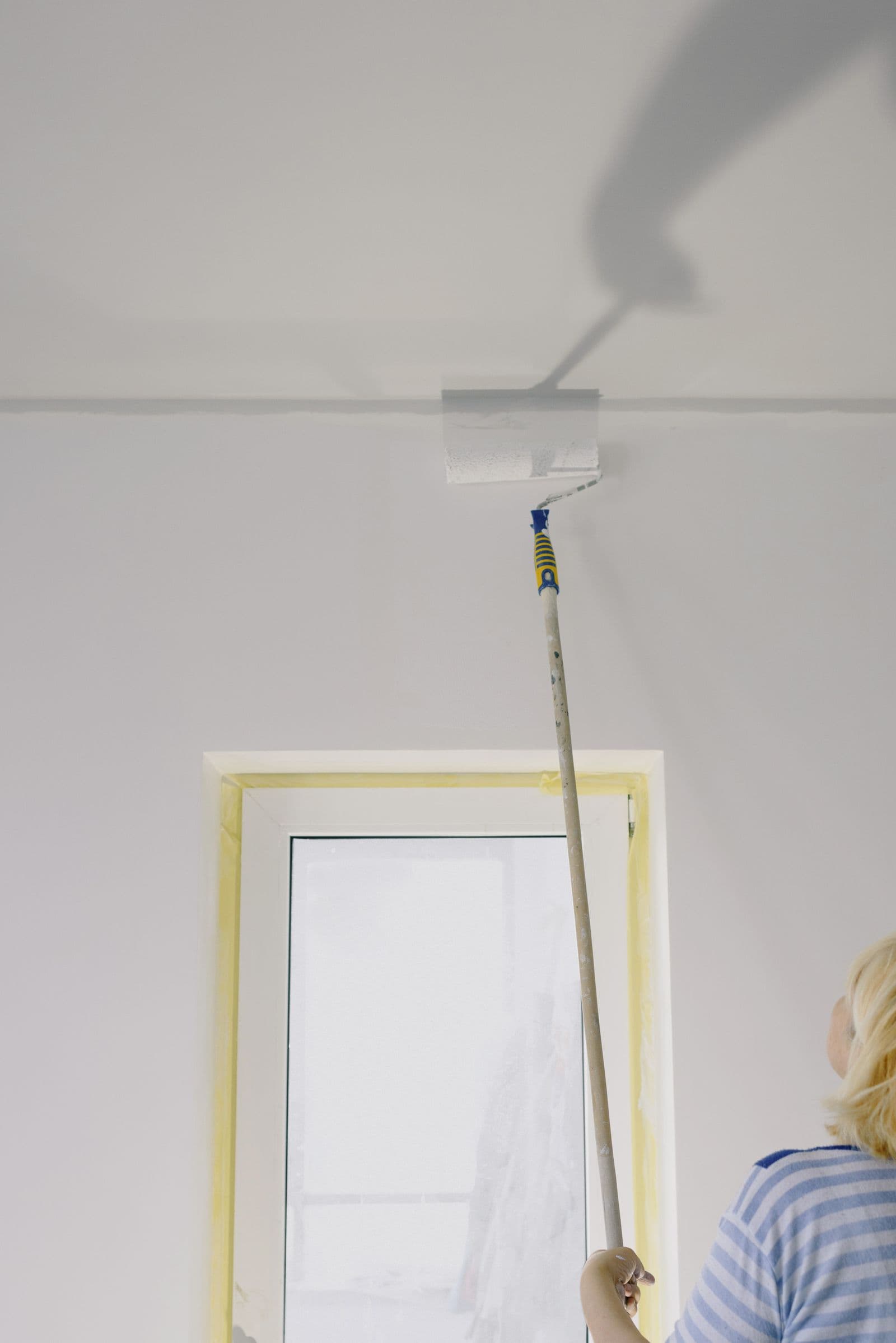 Painting a ceiling above a protected window