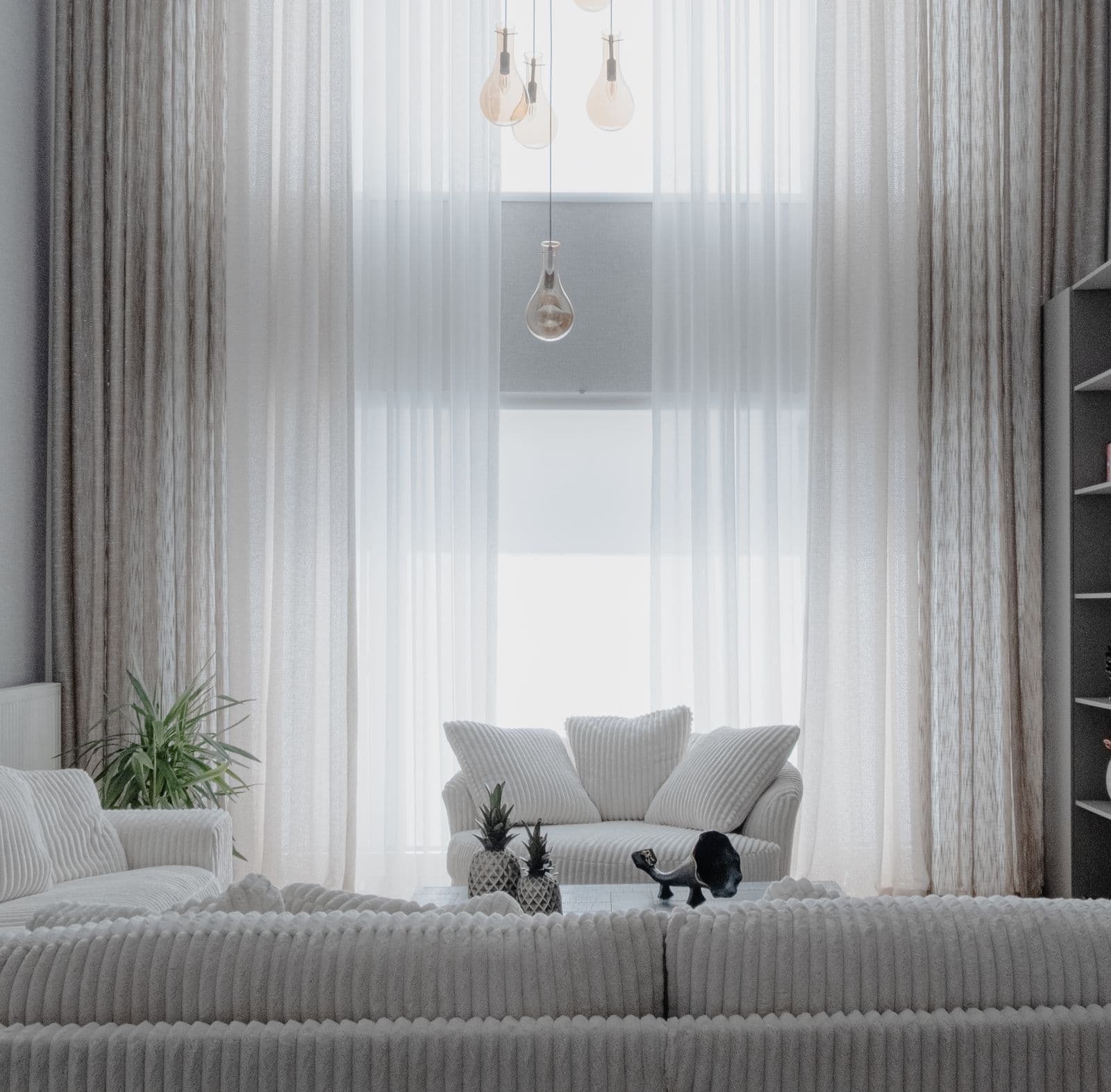 Neutral living room with tall windows